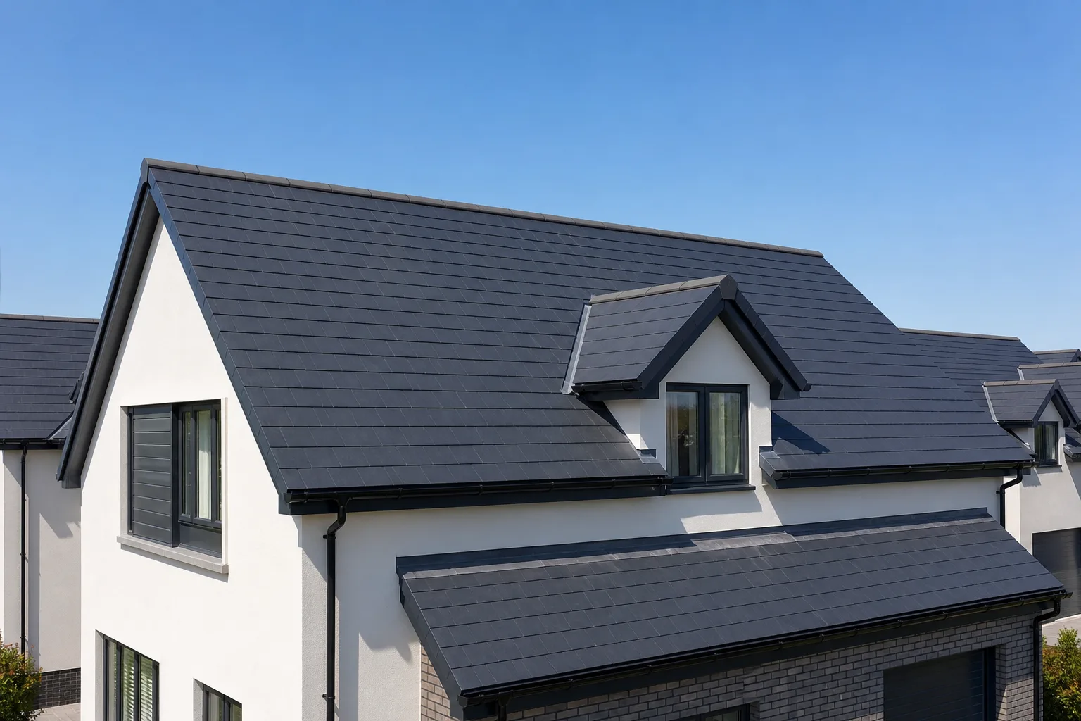 New slate roof installation on British suburban home